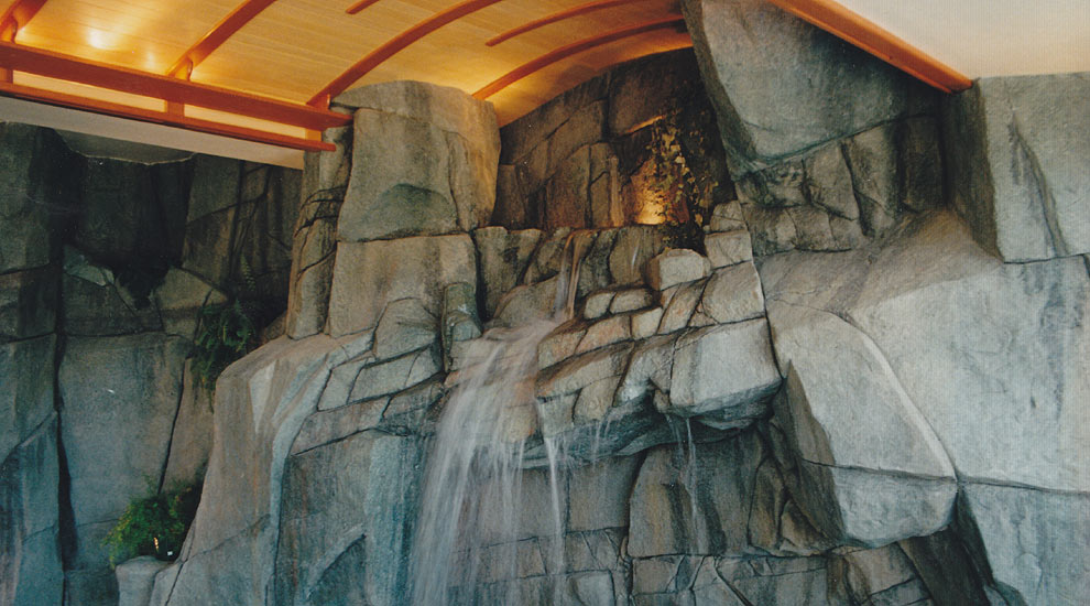 Indoor lap pool with 25' wide water feature.